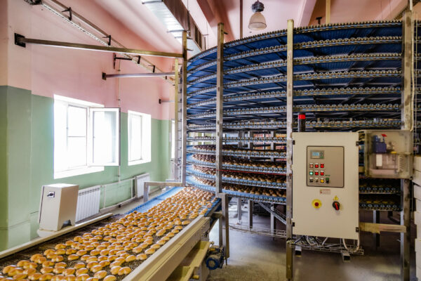 Automated round conveyor machine in bakery food factory, cookies
